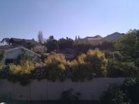 Blocked by houses on the hill above