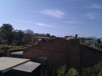 Blocked by houses on the hill above