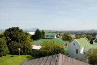 Table mountain on the left.  Tygerberg hill to the right of centre (hidden by haze).  